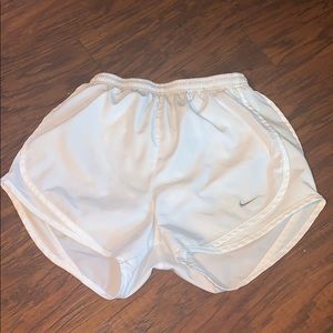 White Nike running shorts